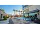 Upscale pool area with white lounge chairs and clear views of surrounding palms at 4381 W Flamingo Rd # 2302, Las Vegas, NV 89103