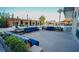Outdoor lounge with blue couches near the pool with private cabanas at 4381 W Flamingo Rd # 2302, Las Vegas, NV 89103