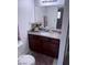 Cozy bathroom with granite countertops, vanity and decorative flowers at 4965 Indian River Dr # 101, Las Vegas, NV 89103