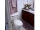 Cozy bathroom with granite countertops, vanity and decorative flowers at 4965 Indian River Dr # 101, Las Vegas, NV 89103
