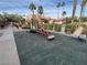 Community playground featuring mature landscaping and shade trees at 4965 Indian River Dr # 101, Las Vegas, NV 89103