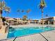Community pool surrounded by palm trees and cabanas at 4965 Indian River Dr # 101, Las Vegas, NV 89103