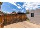 This backyard features a fenced yard, brick patio, and mature landscaping at 516 Delfern Ln, Las Vegas, NV 89169