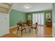 Cozy dining room featuring a round table, four chairs, and lots of natural light at 516 Delfern Ln, Las Vegas, NV 89169
