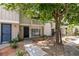 Charming two-story townhome featuring a private entrance and landscaped front yard at 516 Delfern Ln, Las Vegas, NV 89169
