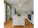 Well-lit kitchen with white cabinets, stainless steel appliances, and a central island at 516 Delfern Ln, Las Vegas, NV 89169