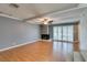 Bright living room with hardwood floors, beamed ceiling, and a cozy fireplace at 516 Delfern Ln, Las Vegas, NV 89169