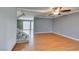Spacious living room features hardwood floors and an open staircase to the upper level at 516 Delfern Ln, Las Vegas, NV 89169