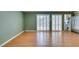 Inviting living room with wood floors and bright, shuttered sliding doors at 516 Delfern Ln, Las Vegas, NV 89169