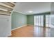 Bright living room featuring wood floors, stairs, and light green accent walls at 516 Delfern Ln, Las Vegas, NV 89169