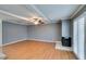 Bright living room with wood floors, beam ceilings, and a cozy fireplace at 516 Delfern Ln, Las Vegas, NV 89169