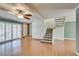 Cozy living room featuring stairs, wood floors, and shuttered doors at 516 Delfern Ln, Las Vegas, NV 89169