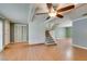 Inviting living room with stairs, wood floors, and shuttered doors at 516 Delfern Ln, Las Vegas, NV 89169