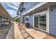 Charming condo exterior featuring blue siding, private patio, and convenient covered parking at 5335 Rod Ct # 103, Las Vegas, NV 89122