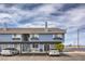 Two-story condo with a carport and additional parking under a cloudy sky at 5335 Rod Ct # 103, Las Vegas, NV 89122