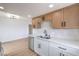 Bright kitchen featuring stainless steel appliances, light wood cabinets, and a double basin sink at 5335 Rod Ct # 103, Las Vegas, NV 89122