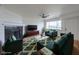 Comfortable living room features stylish furniture and a view of the water at 5335 Rod Ct # 103, Las Vegas, NV 89122