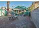 The property has a fully fenced backyard, a covered patio, and a small storage shed at 553 Dutchman Ave, Henderson, NV 89011