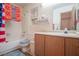 Bathroom featuring shower/tub combo and wooden vanity at 553 Dutchman Ave, Henderson, NV 89011
