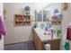 Cozy bathroom shows a vanity with plenty of storage and good lighting at 553 Dutchman Ave, Henderson, NV 89011