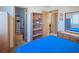 Bright bedroom with cozy carpeting and built in shelving at 553 Dutchman Ave, Henderson, NV 89011