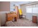 Spare bedroom with vintage roll top desk and plenty of natural light at 553 Dutchman Ave, Henderson, NV 89011