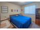 Bright bedroom with cozy carpeting, large window, and built in shelving at 553 Dutchman Ave, Henderson, NV 89011