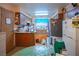 Well-lit kitchen featuring plenty of counter space and a refrigerator at 553 Dutchman Ave, Henderson, NV 89011