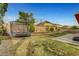 Large backyard featuring a trampoline and ample space for outdoor activities at 5642 Breckenridge St, North Las Vegas, NV 89081
