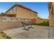 Private backyard featuring a concrete patio and mature landscaping at 5642 Breckenridge St, North Las Vegas, NV 89081
