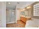 Bright bathroom with double vanity, soaking tub, and separate shower at 5642 Breckenridge St, North Las Vegas, NV 89081