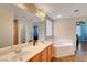 Bright bathroom featuring double sinks and a tub at 5642 Breckenridge St, North Las Vegas, NV 89081