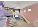 ' bedroom with bunk beds, slide, ceiling fan and plenty of light at 5642 Breckenridge St, North Las Vegas, NV 89081