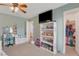 Charming bedroom with bright decor, closet, and access to bathroom at 5642 Breckenridge St, North Las Vegas, NV 89081