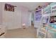 Charming bedroom featuring a cute bunk bed with an open closet with lots of toys at 5642 Breckenridge St, North Las Vegas, NV 89081