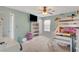 Bedroom with a ceiling fan, TV, bunkbeds, and carpeted floor at 5642 Breckenridge St, North Las Vegas, NV 89081