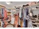 Spacious walk-in closet with custom shelving and ample storage for clothes and accessories at 5642 Breckenridge St, North Las Vegas, NV 89081