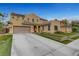 Spacious two-story home with a wide driveway, two-car garage, and well-maintained front yard at 5642 Breckenridge St, North Las Vegas, NV 89081