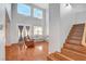 Bright living room with high ceilings, wood floors, comfortable seating, and large windows for natural light at 5642 Breckenridge St, North Las Vegas, NV 89081