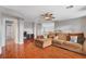 Spacious living room with a ceiling fan and an office at 5642 Breckenridge St, North Las Vegas, NV 89081