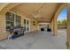 Covered patio with a built-in grill and ample space for outdoor dining at 5642 Breckenridge St, North Las Vegas, NV 89081