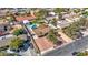 Aerial shot of a home with mature palm trees, spacious driveway, and in-ground pool within a residential neighborhood at 6117 Foxcroft Ave, Las Vegas, NV 89108