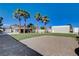 Expansive backyard with palm trees, RV parking, and a detached garage/workshop at 6117 Foxcroft Ave, Las Vegas, NV 89108