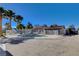 Backyard featuring a fenced pool area, palm trees, and ample space for entertaining at 6117 Foxcroft Ave, Las Vegas, NV 89108