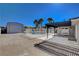 Outdoor retreat with fenced pool, large storage building, covered patio, and landscaping to offer ample backyard space at 6117 Foxcroft Ave, Las Vegas, NV 89108