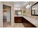 Bathroom boasts granite counters, double sinks, and stylish lighting at 6117 Foxcroft Ave, Las Vegas, NV 89108