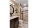 Bathroom with a single sink vanity and tiled walk-in shower at 6117 Foxcroft Ave, Las Vegas, NV 89108