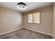 Cozy bedroom with carpet, window with shutters, and contemporary ceiling light at 6117 Foxcroft Ave, Las Vegas, NV 89108