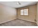 Comfortable bedroom featuring carpet and a window with shutters for privacy at 6117 Foxcroft Ave, Las Vegas, NV 89108