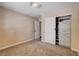 Bedroom features modern lighting, neutral colors and a closet with built-ins at 6117 Foxcroft Ave, Las Vegas, NV 89108